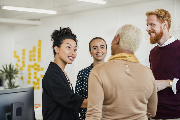 two business women helping clients