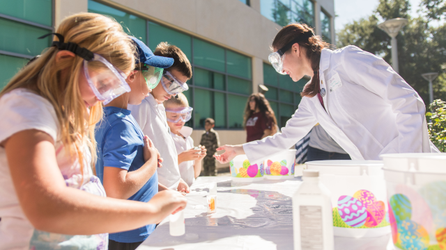 Student demonstrating activity to children