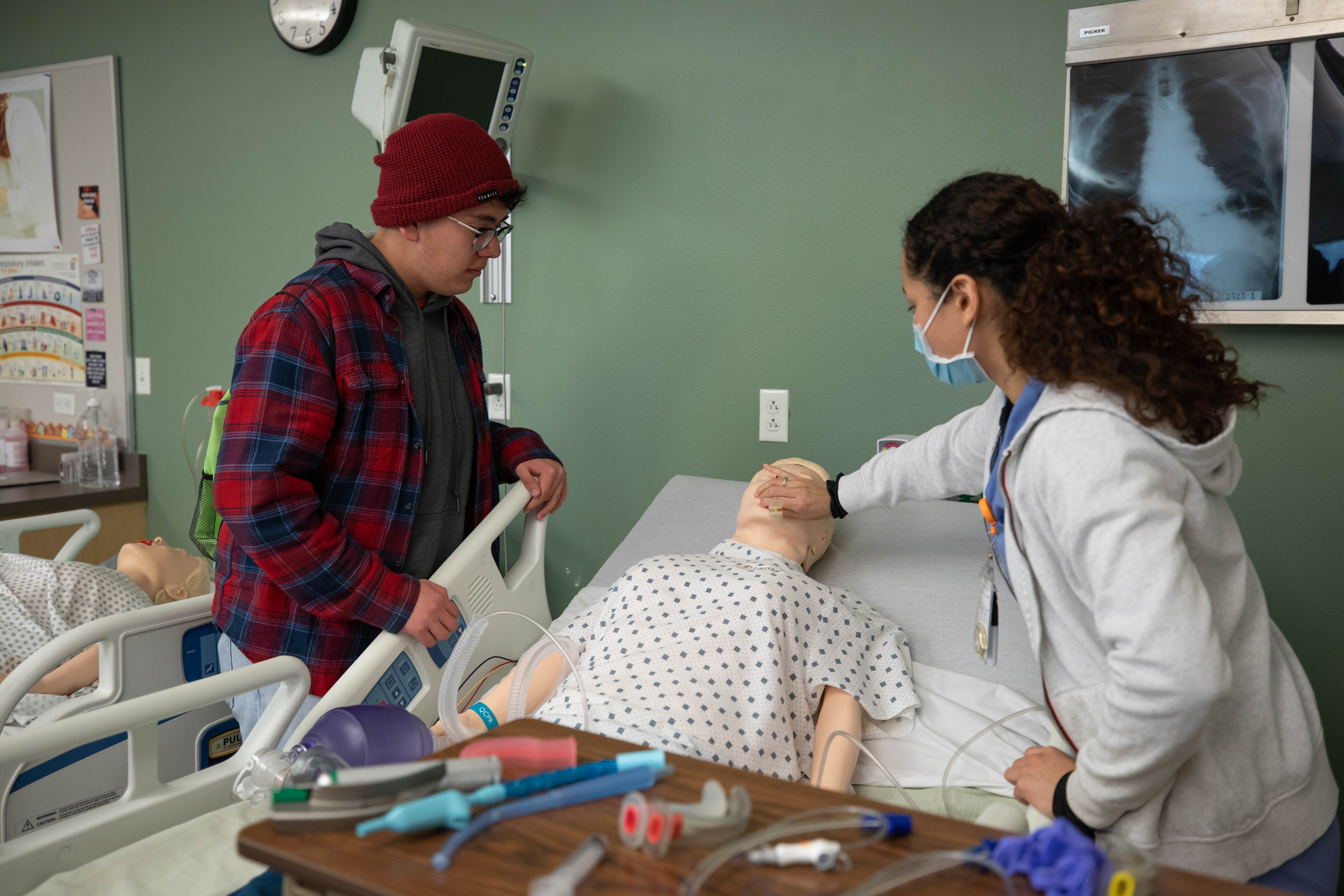 Students around hospital bed