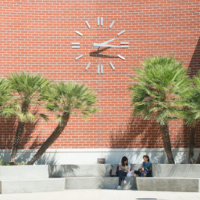 building 26 clock with students