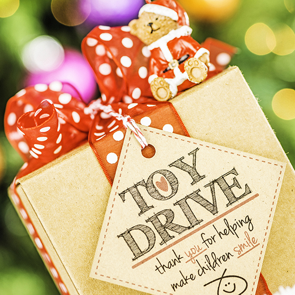 A wrapped holiday gift with a thank you note.