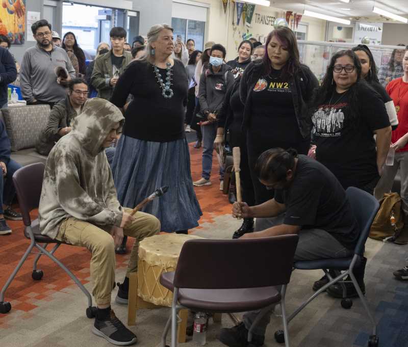 Borella (L), Rocha (center) and others dance to the Cesnea's drumming