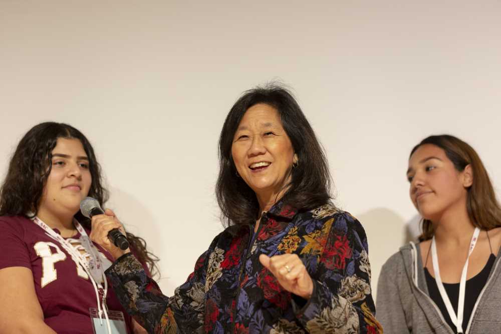 Audrey on stage with students