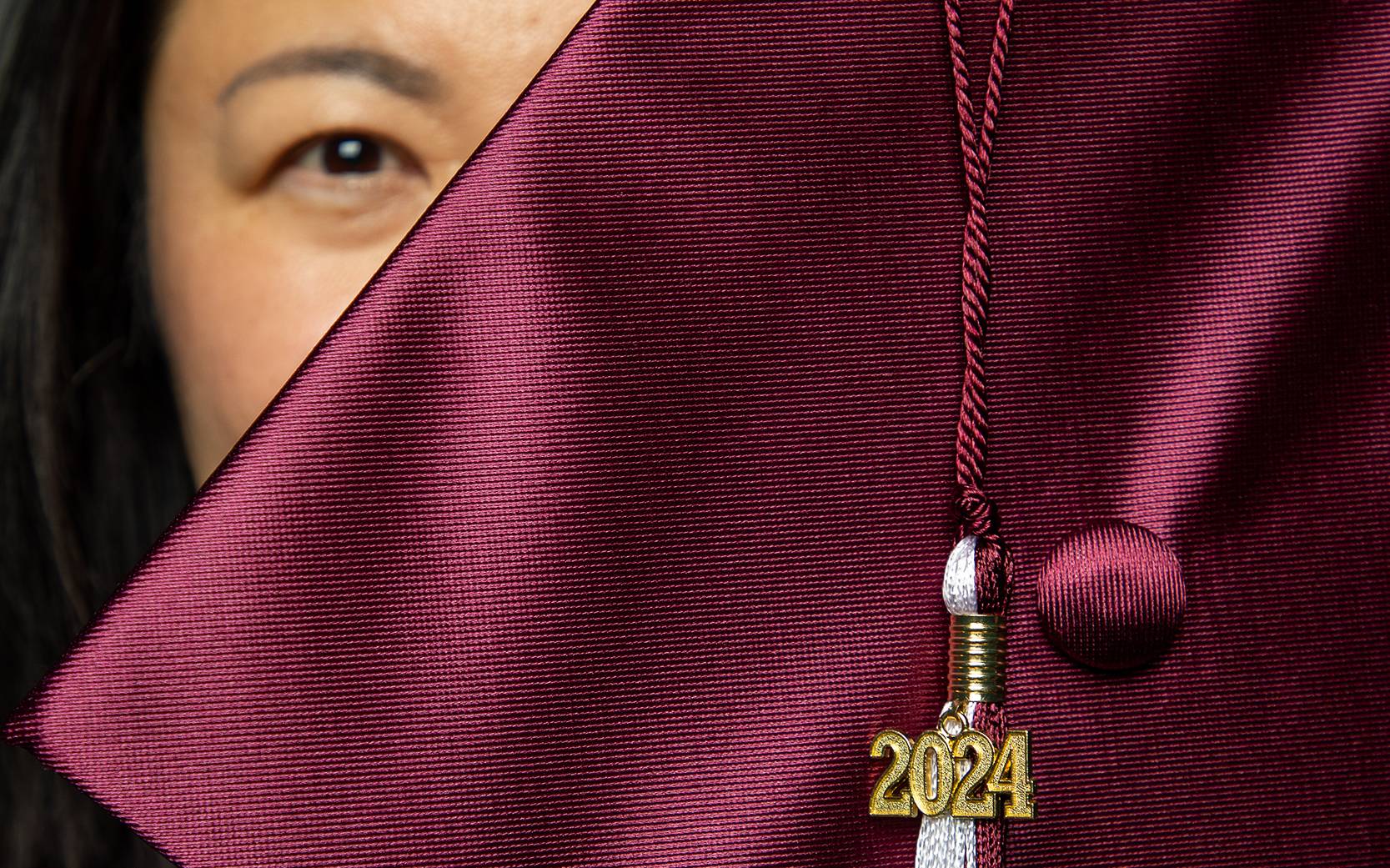 student holding graduation cap
