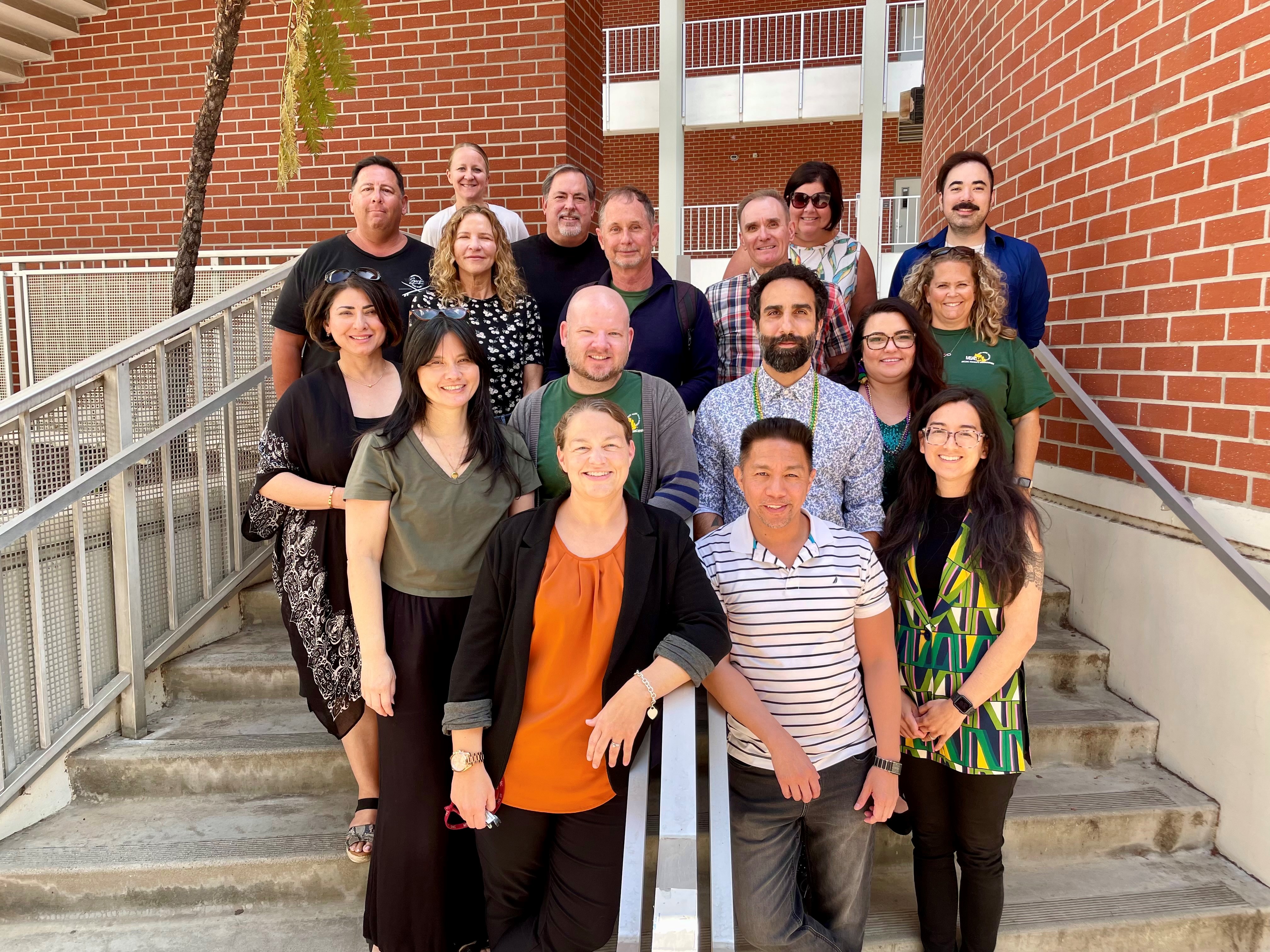 Psychology faculty on stairwell up to psychology department