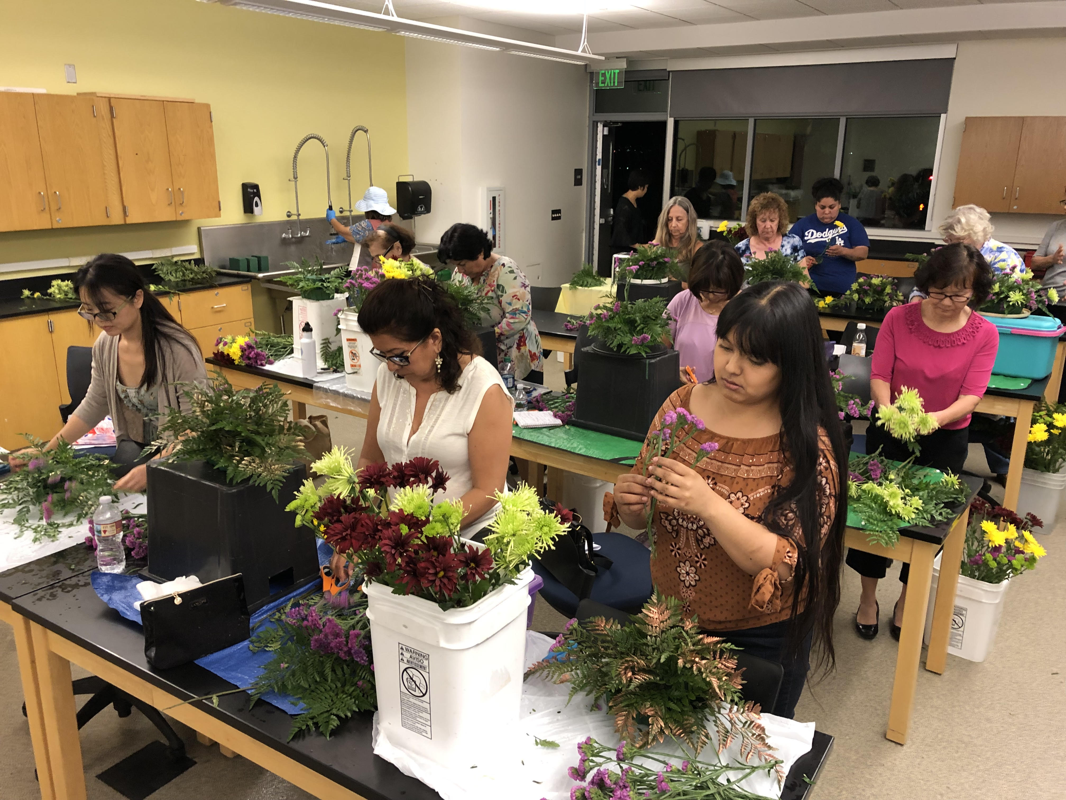 students creating floral arrangment