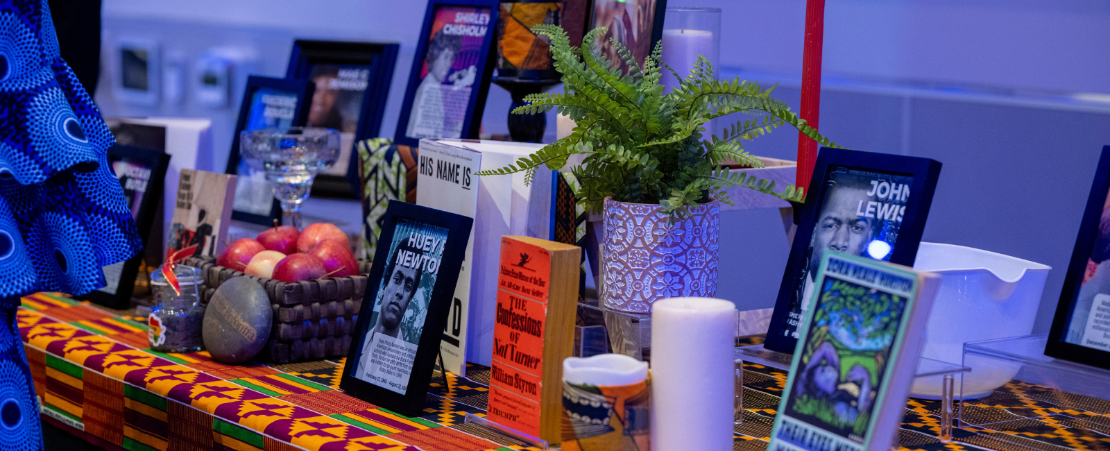 african alter with books and black historical figures displayed